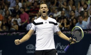 Mikhail Youzhny from Russia celebrates winning the final match against David Ferrer from Spain, at ATP 500 World Tour Valencia Open tennis tournament at the agora building of the Ciudad de las Artes y las Ciencias in Valencia, Spain, Sunday Oct. 27, 2012. Mikhail Youzhny won 6-3, 7-5. (AP Photo/Alberto Saiz)